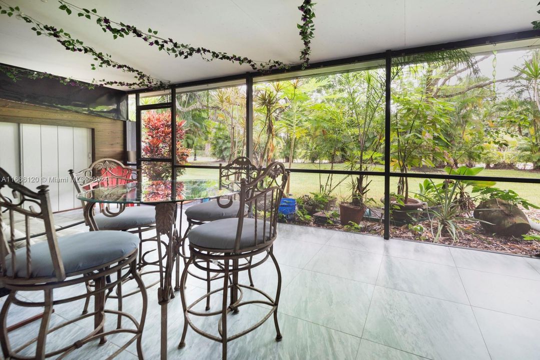 Screened porch with access to yard.