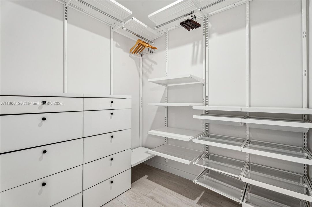 Primary bedroom walk-in closet