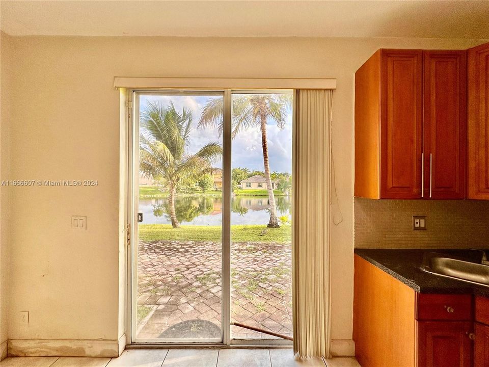 Kitchen view of lake & access to back patio