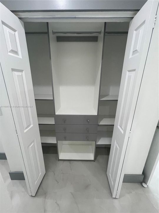 Custom closet in primary bedroom