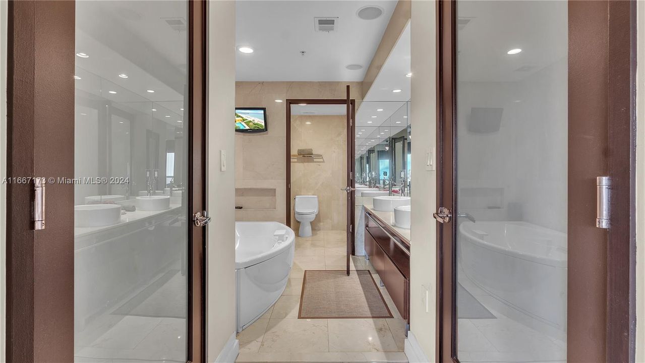 Stunning Marble Master Bath, Complete with Double Sinks, Jacuzzi Tub, Separate Toilet & Stand Up Shower.  All Marble Baths & Floors