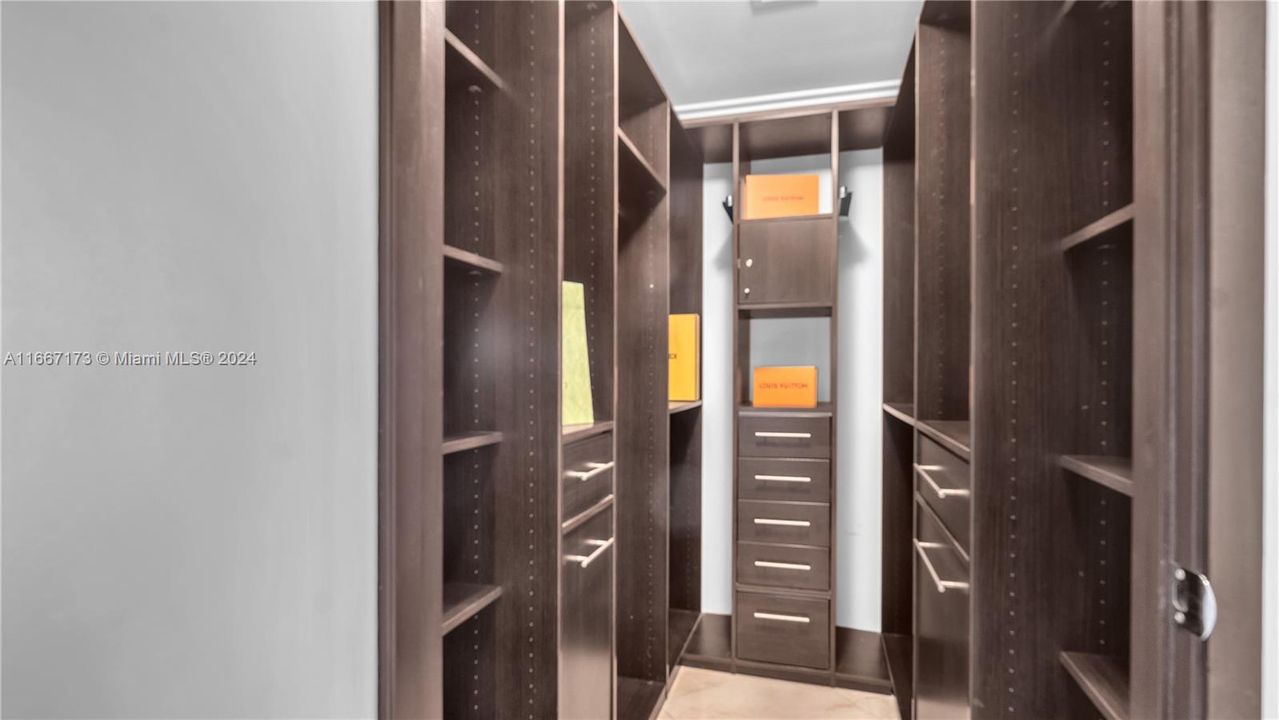 Master Custom Built Walk-in Closet w/ the Works