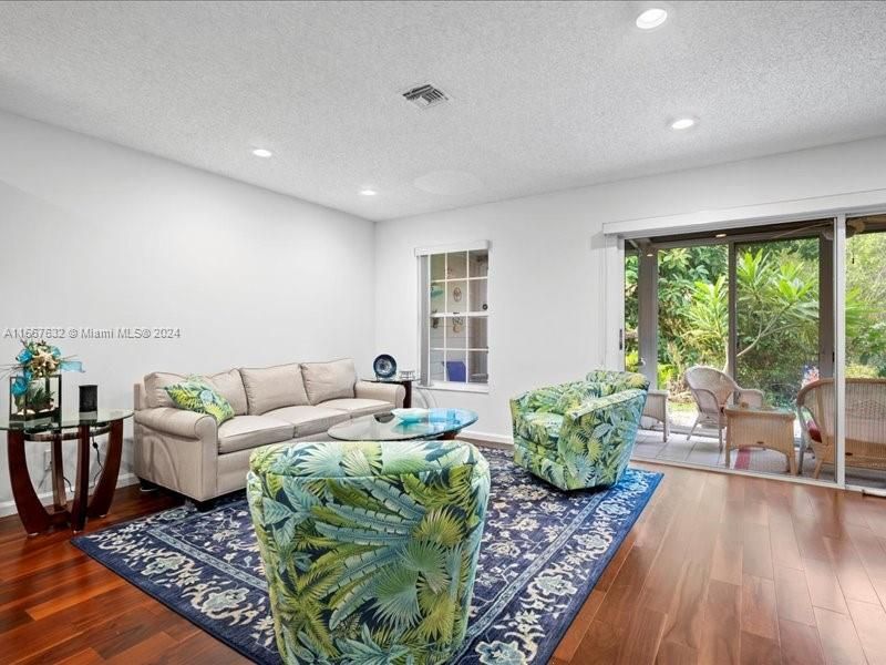 Beautiful wood like flooring throughout the main floor. Nice flow with the porch open