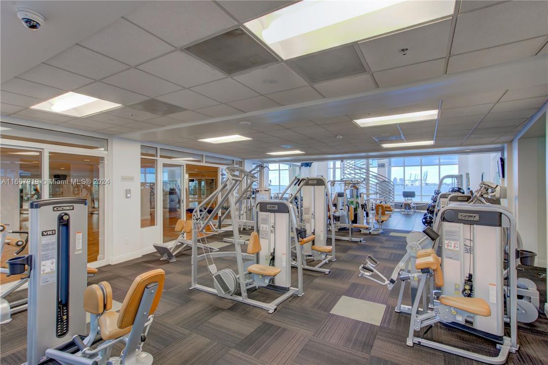 Multi-Level Health Club, with inside racquet courts, spin bikes, weight machines, treadmills.