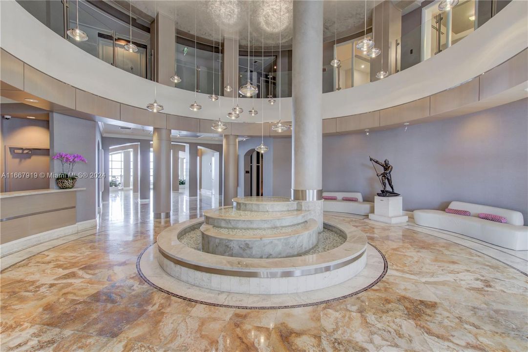 Lobby with view of Concierge Desk & 2nd Level Meeting Room.