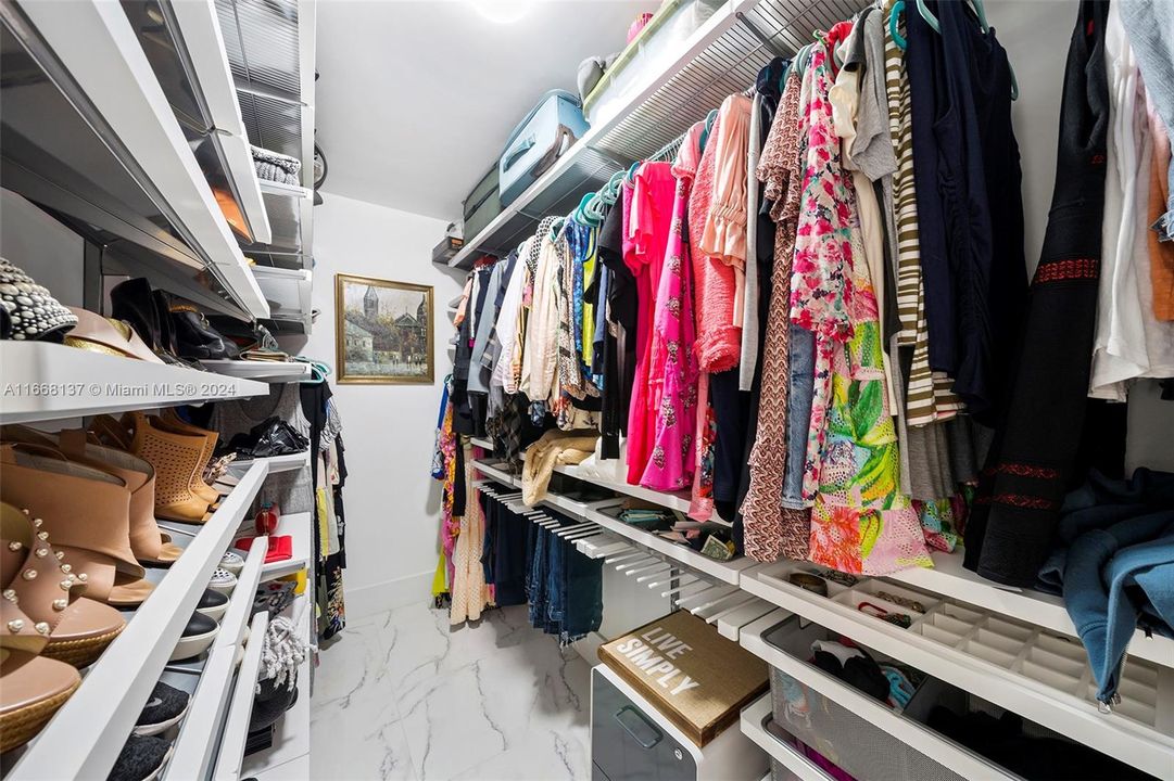 Primary bedroom walk-in closet