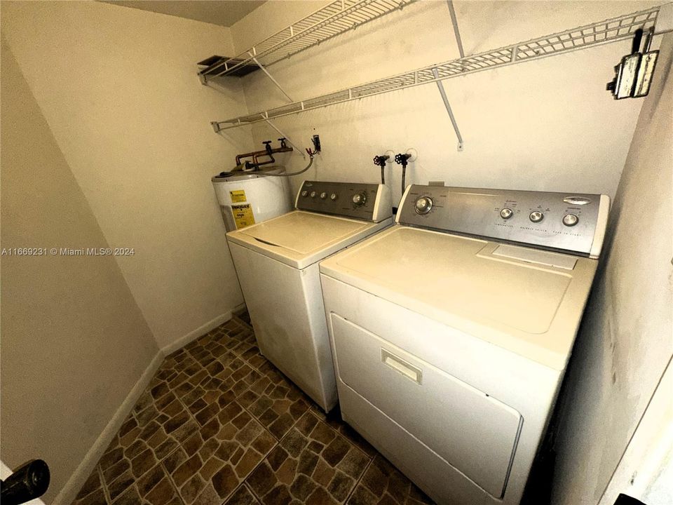 Laundry room next to kitchen