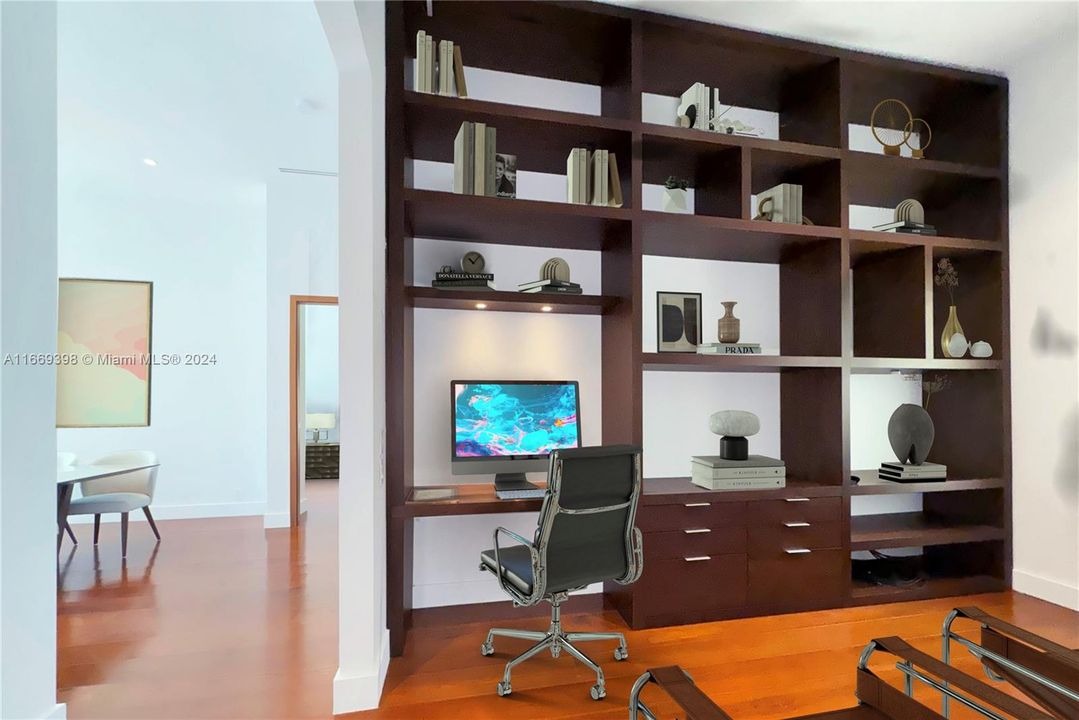 Office has a custom made built-in library, and a wall mounted TV that will stay.