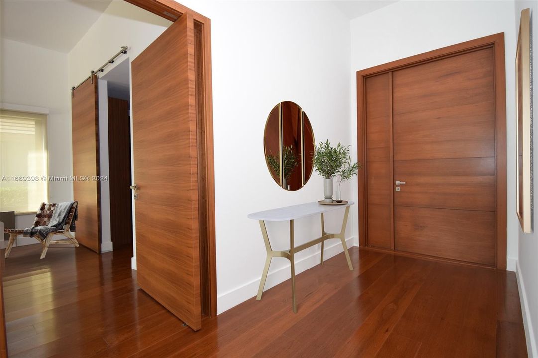 Custom made doors throughout: Front door is hurricane impact resistant and is made with double leaf oak veneered timber.