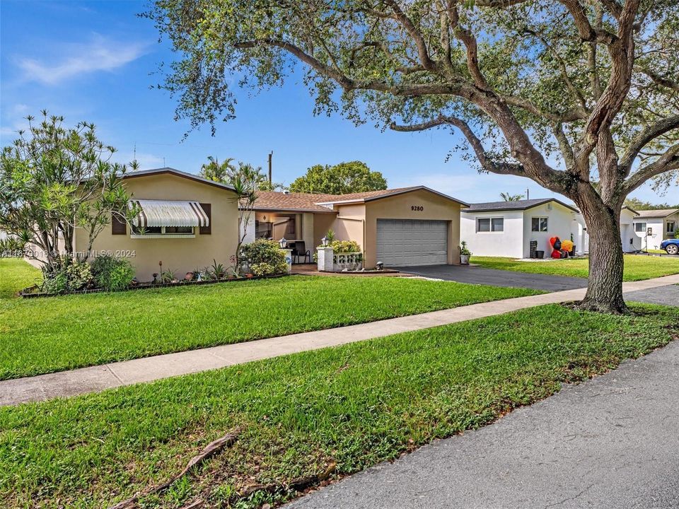 Gorgeous curb appeal with mature trees