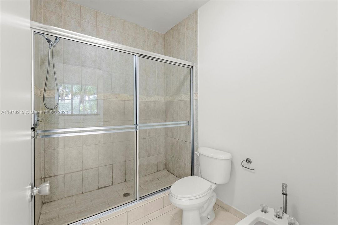 Shower and water closet with bidet