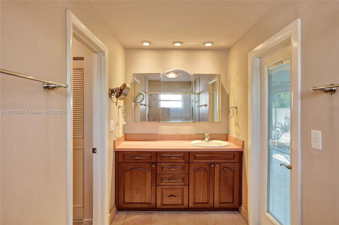 High Hat Lighting Accent the Vanity. Cabana bath door for your pool convenience!