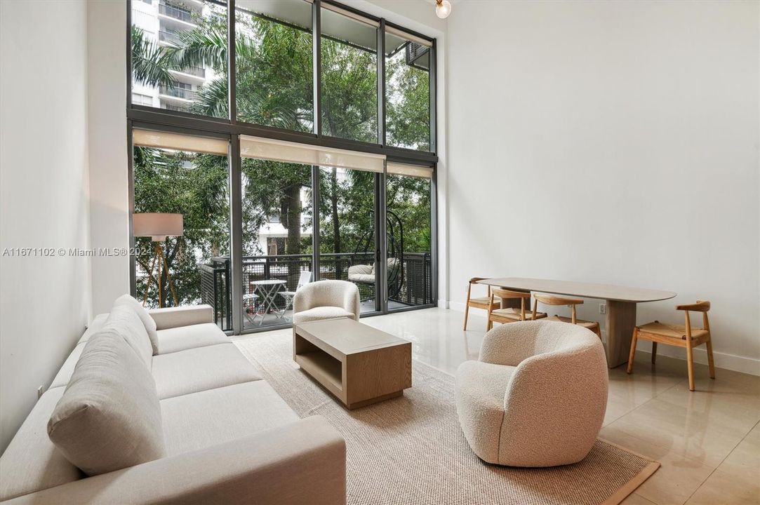 Open Layout Kitchen/Living/Dining Room w/ Double Height Ceilings