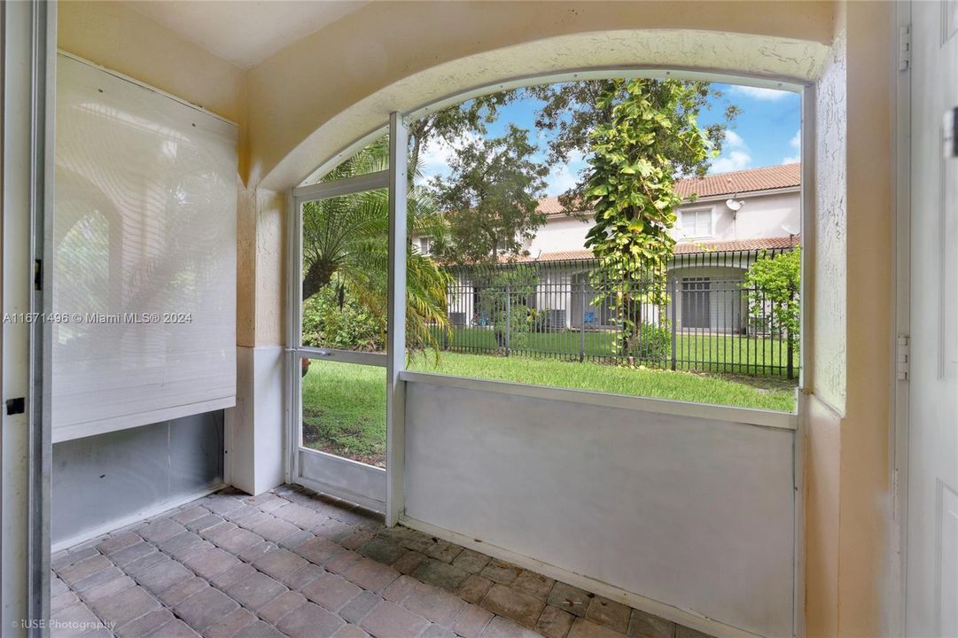 Enjoy morning coffee in your screened private porch.