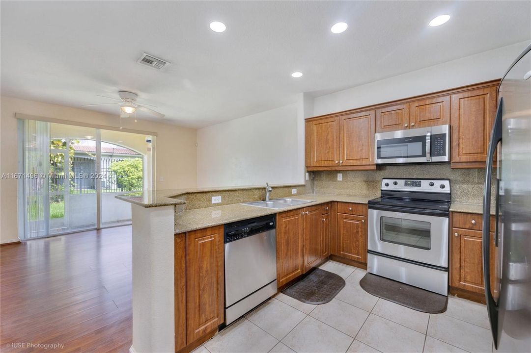 Entertain while you cook with a breakfast bar leading into the dining/second living space.