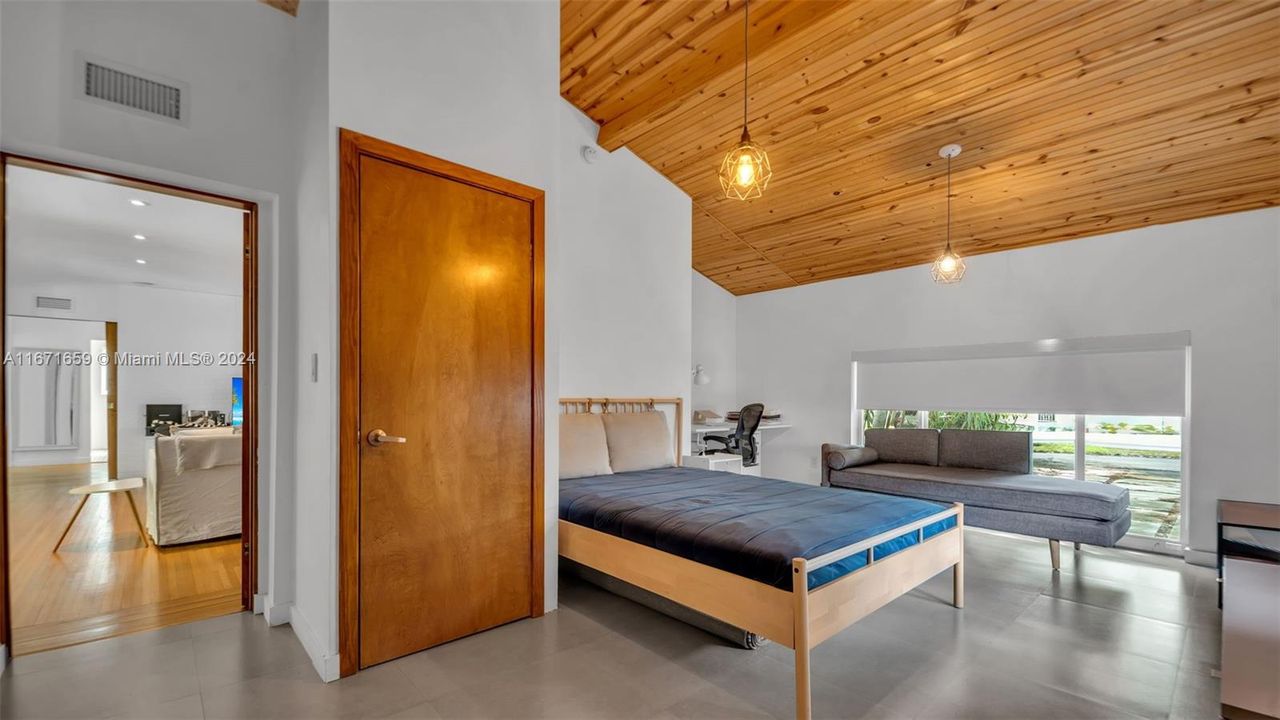 Bedroom with beautiful vaulted wood ceiling