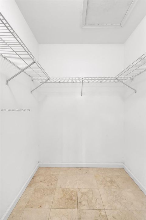 Large walk-in closet in primary bedrm