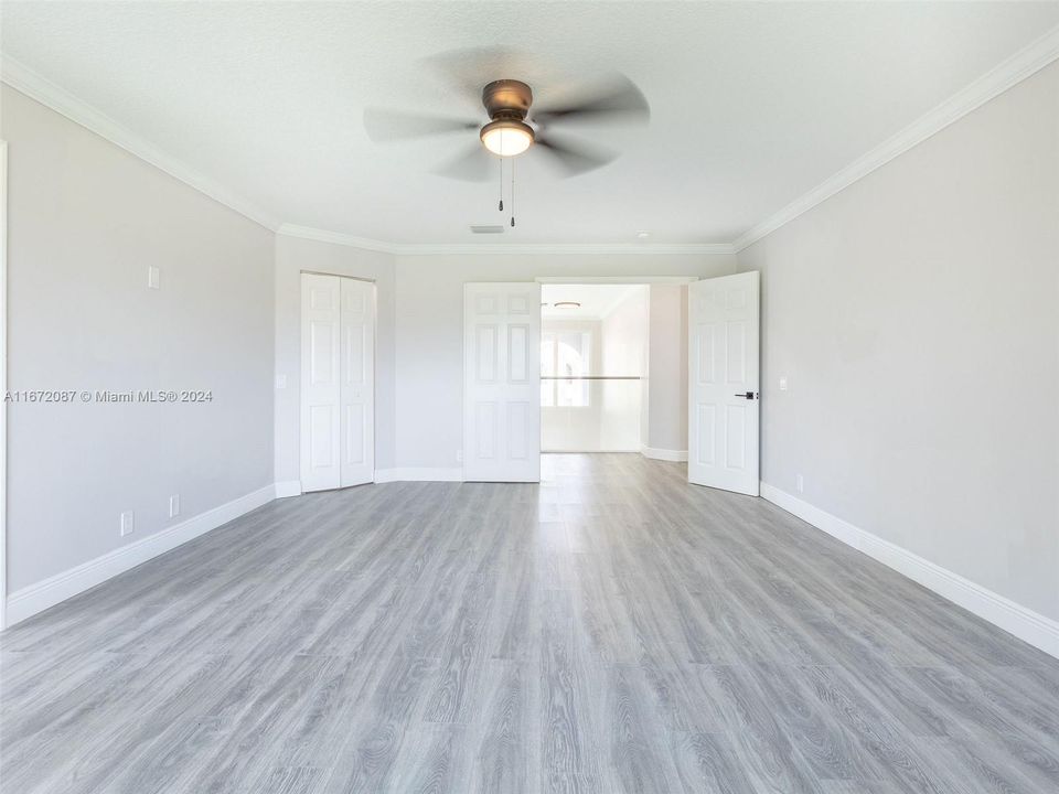 Huge primary bedroom with double doors