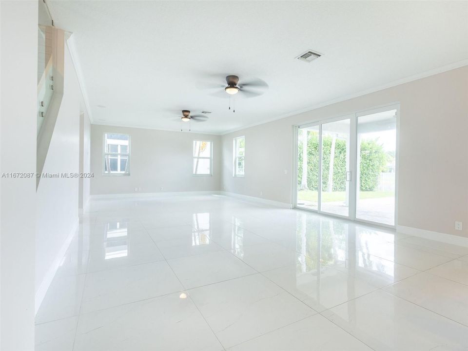 Massive family room and breakfast areas overlooking the pool and lake