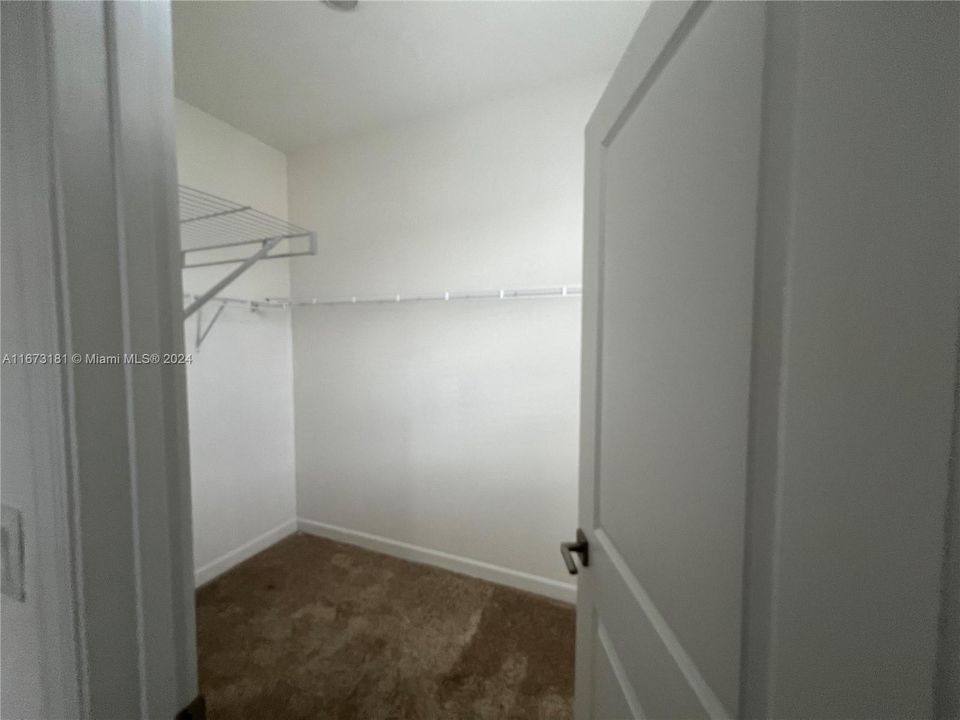 walk-in closet for primary bedroom