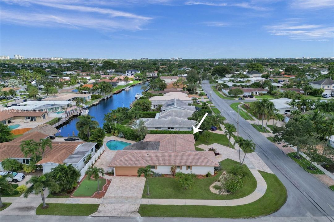 Enormous corner home with two driveways and a putting green.