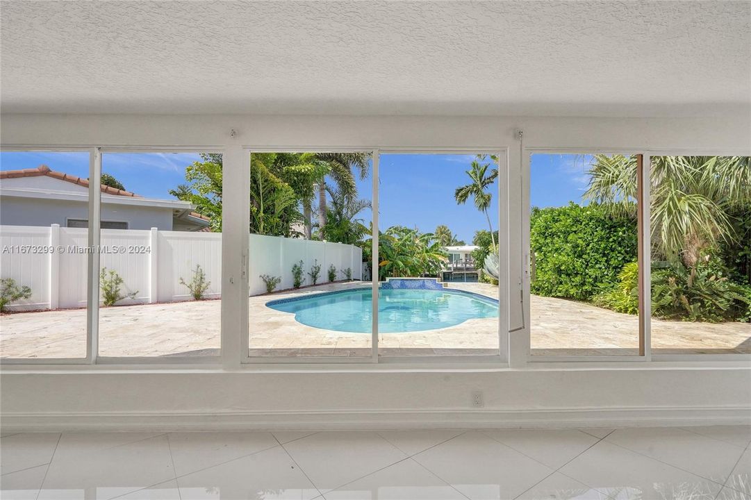 Wall to wall windows overlooking your pool.