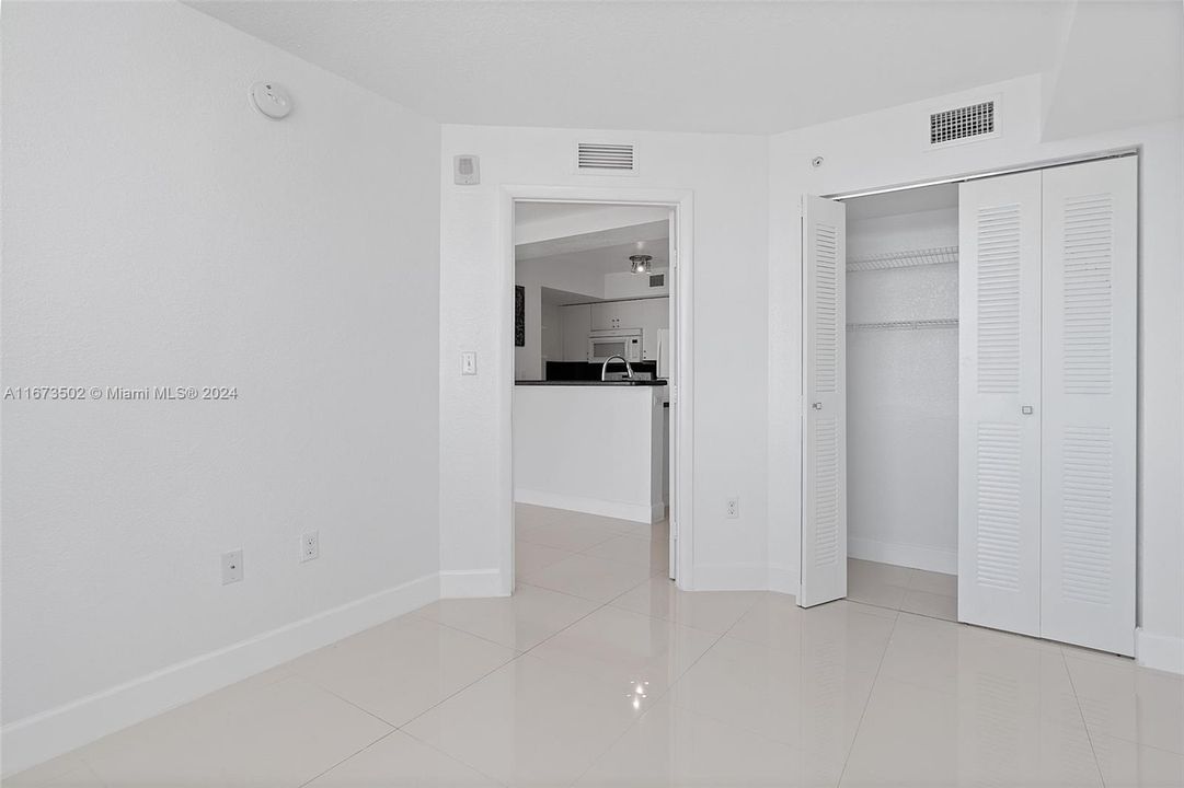 Mater bedroom, closet on right of frame. Kitchen on left.