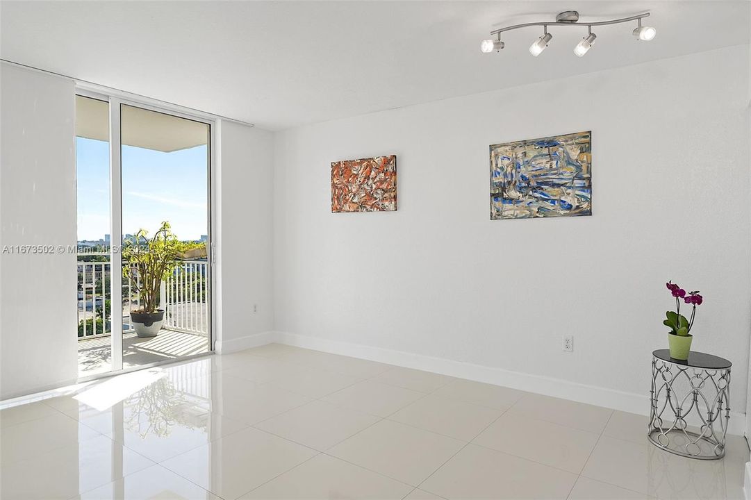 View of living room area.  Sliding doors to balcony, looking east.