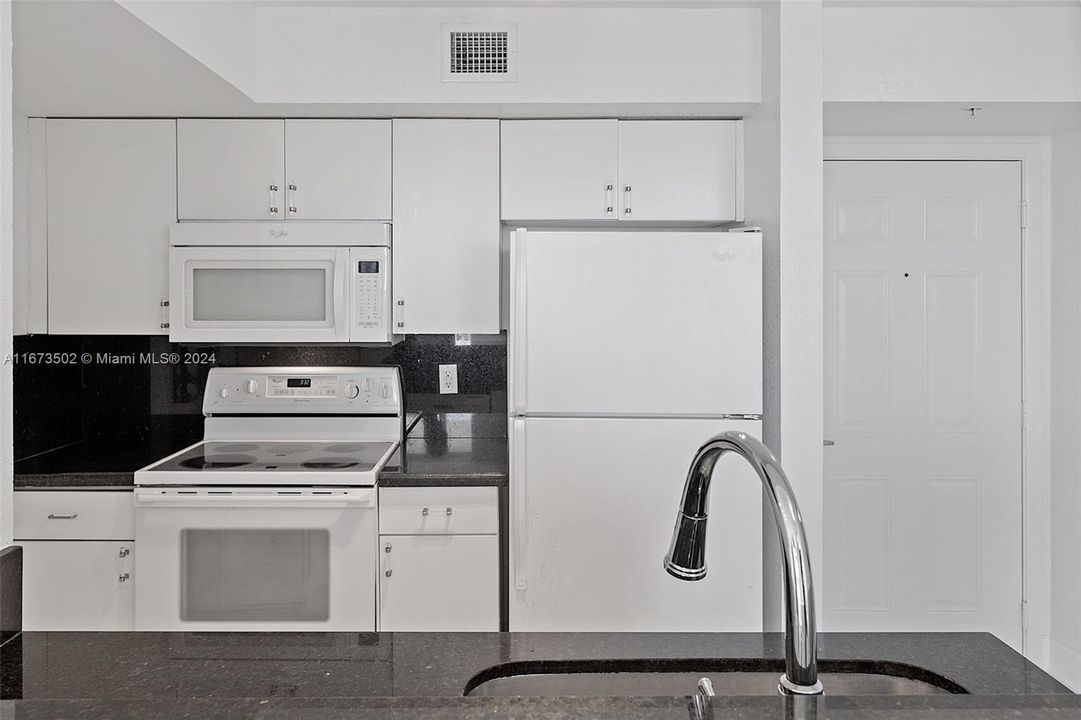 Looking into kitchen.