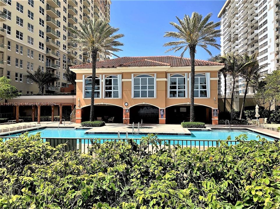 Pool view looking into cabana, clubhouse and gym structure