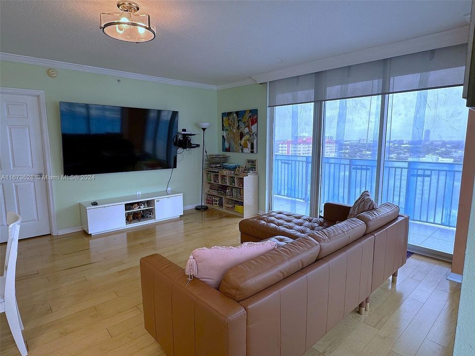 Spacious living room for watching the TV and west city views