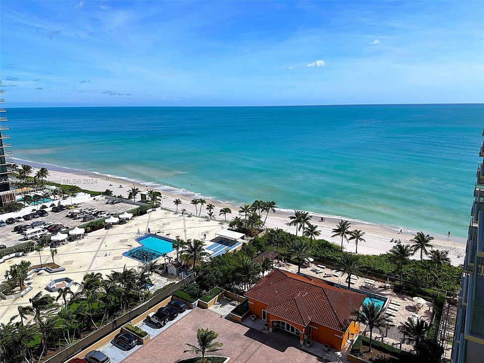 View of beach, pool, gym and clubhouse building