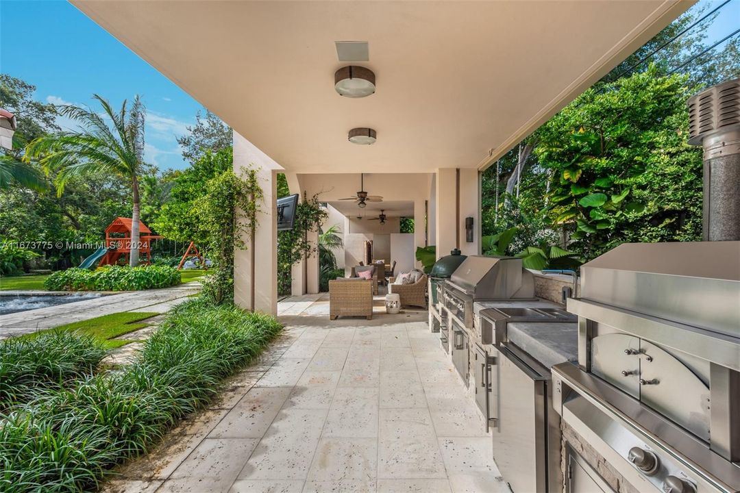 Summer/Outdoor Kitchen with pizza oven, grill and green egg. Poolside Pavilion