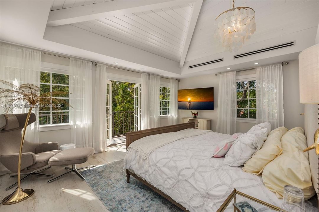 Guest House's upstairs bedroom with private balcony