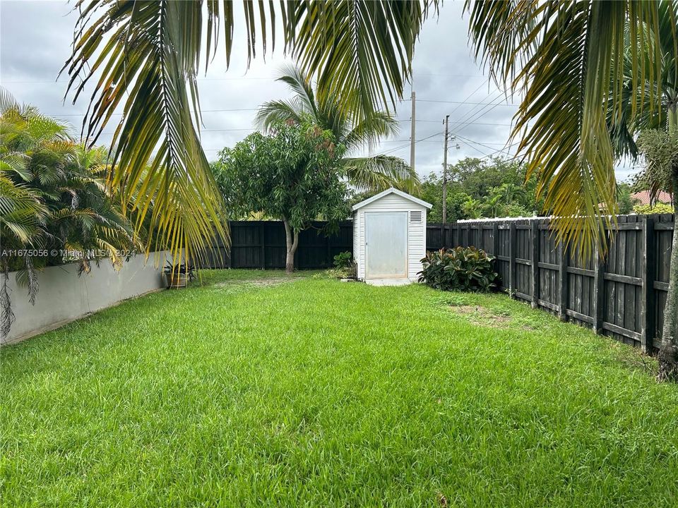 SHED IN FENCED YARD