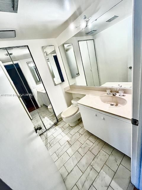 half bathroom with washer & dryer closet