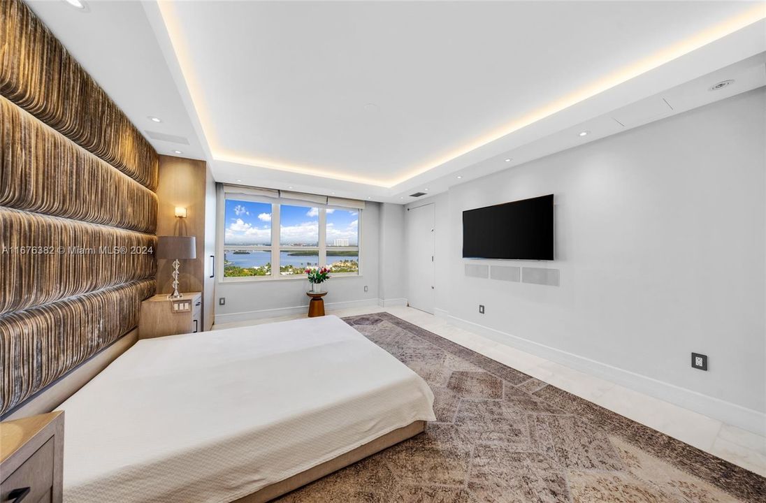 Large master bedroom looking at the sunsets Intercostal and city views