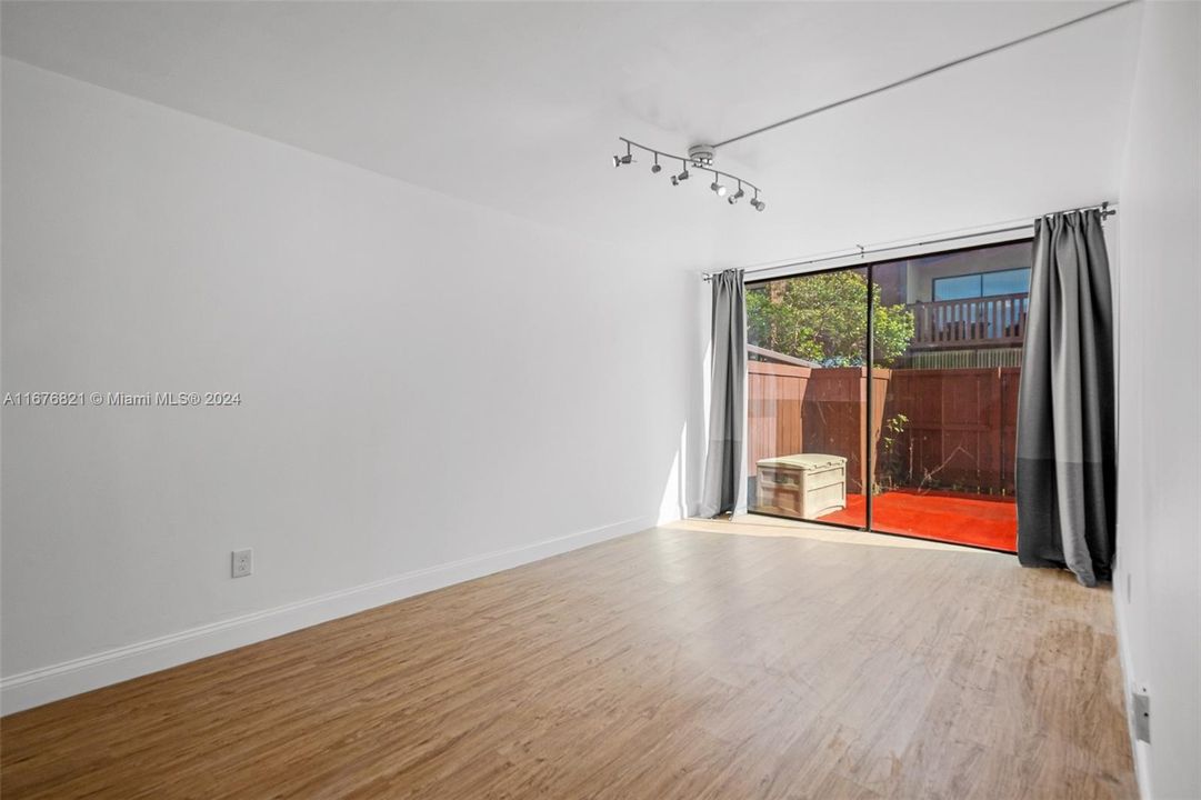 Master-sized 2nd bedroom with sliding doors facing the back patio!