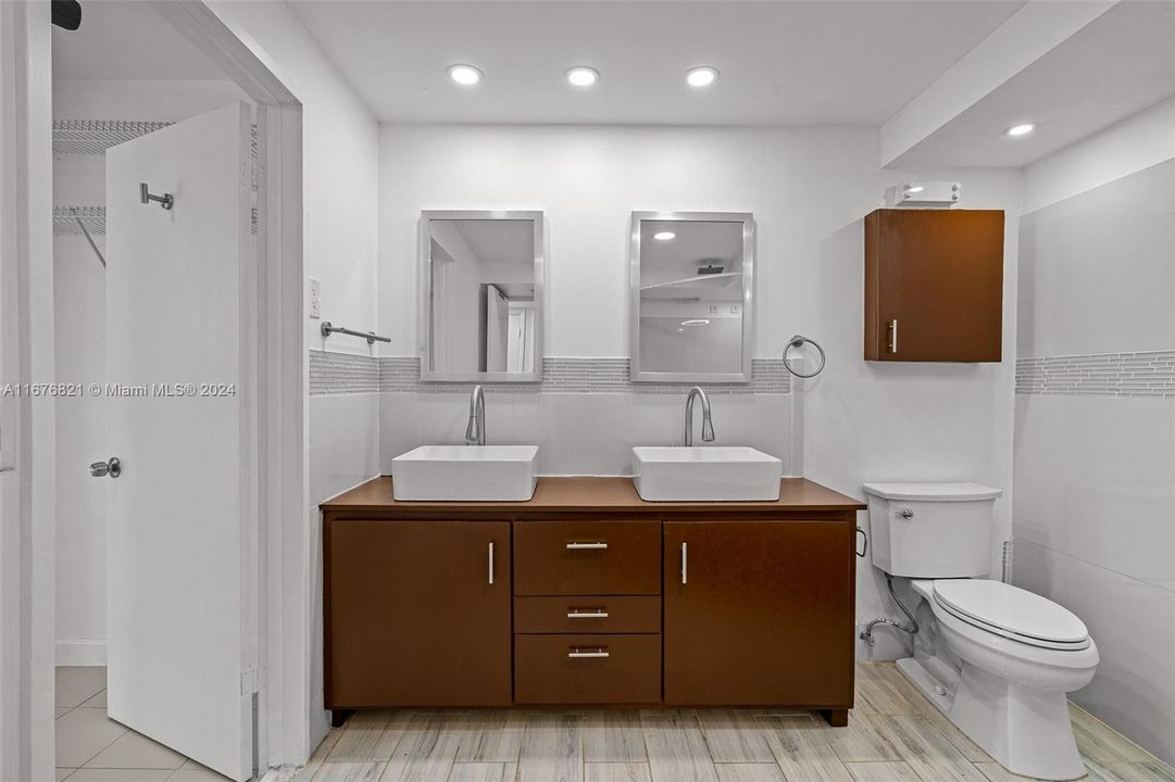 Doub le-sink vanity and recessed lighting.