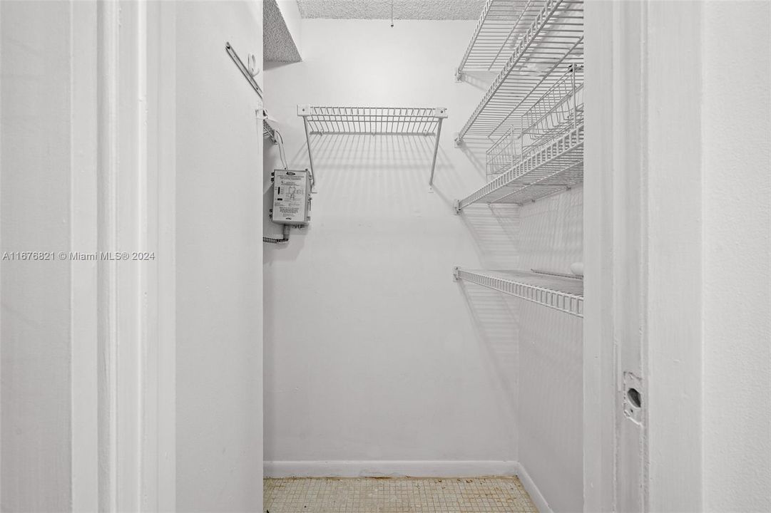 Utility Closet. Mighty space for your brooms, tools and cleaning equipment!