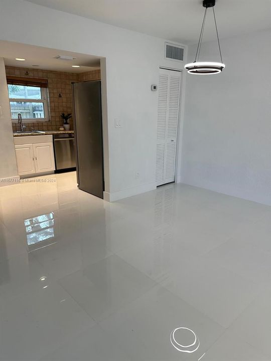 New porcelain flooring, lighting and remolded kithcen