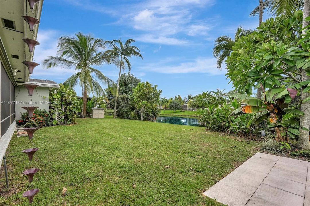 Large well manicured yard complete with mango, banana & coconut trees.