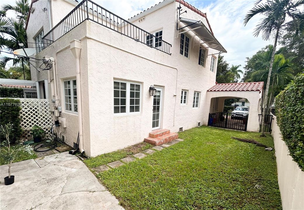 Back Facade/Side Entrance to Kitchen