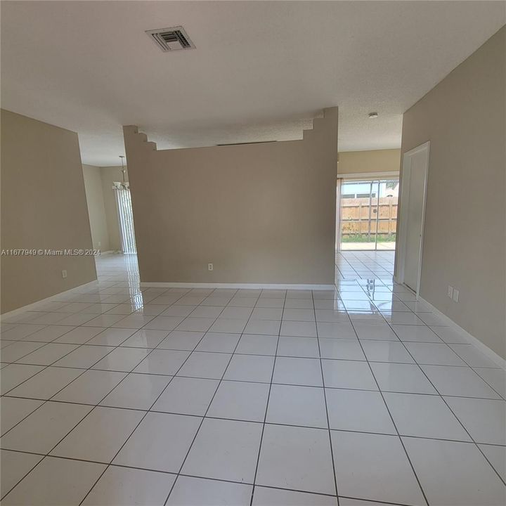 View from living room to family room and dining room.