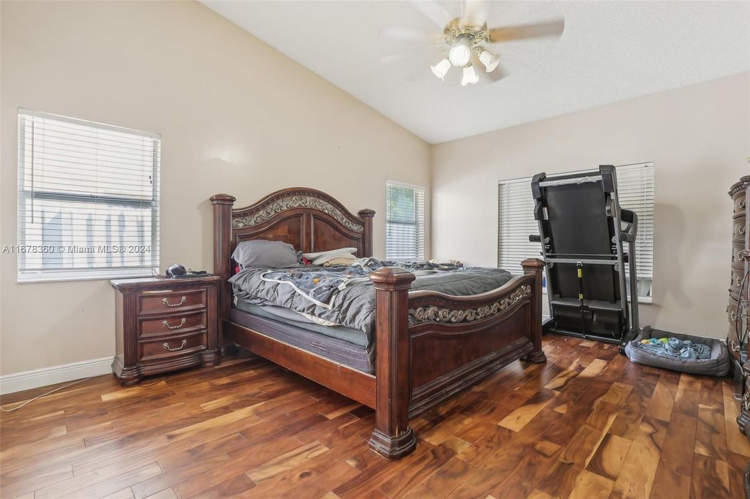 Vaulted ceilings in primary suite & wood flooring