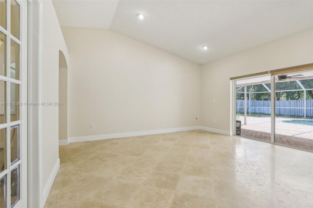 Vaulted Ceiling in Living Room overlooking Pool