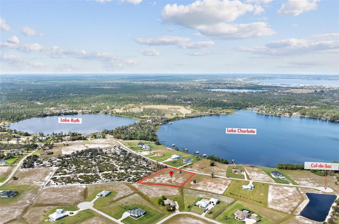 Northwestern aerial view overlooking the private community of Highland Lakes Reserve's Lake Charlotte and Lake Ruth. 4013 Camp Shore Drive is located four lots from the cul-de-sac across the street from Lake Charlotte.