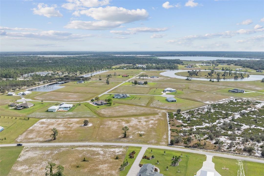 Southern aerial view overlooking 4013 Camp Shore Drive and the beautiful estates of Highland Lakes Reserves.