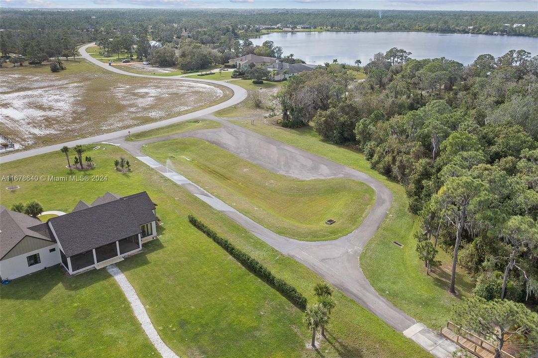 Aerial view of entry to Highland Lakes Reserve exclusive community boat ramp and dock area.