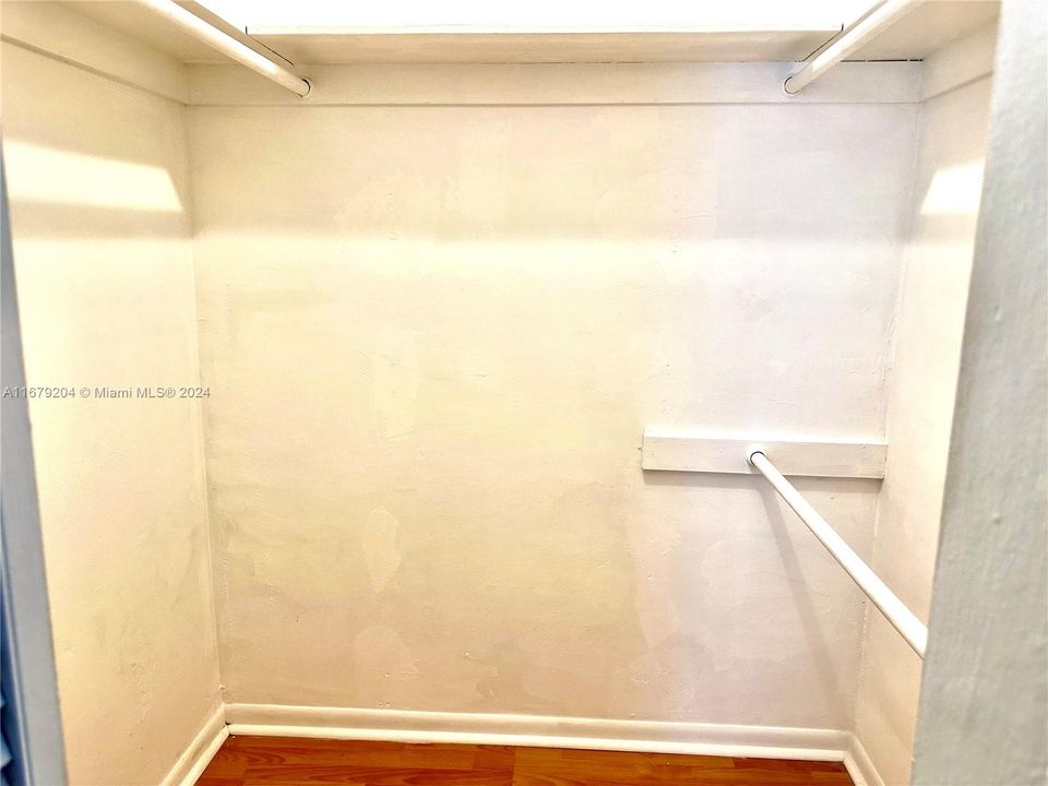 Walk In Closet, one of two bedroom closets.